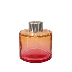 Okrągły dyfuzor zapachowy w kolorze różowo pomarańczowego ombre