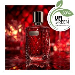 Czerwony flakon perfum na lustrzanym tle.