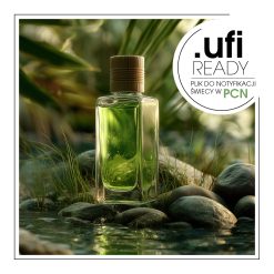 Perfumy umieszczone na skale z liściem obok.