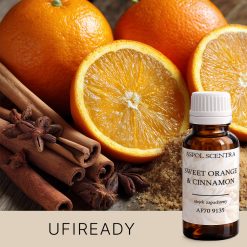 Grupa pomarańczy i cynamonowych lasek na stole.