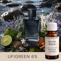 Flakon perfum przy rzece wśród kamieni, ziół, kwiatów i cytrusów